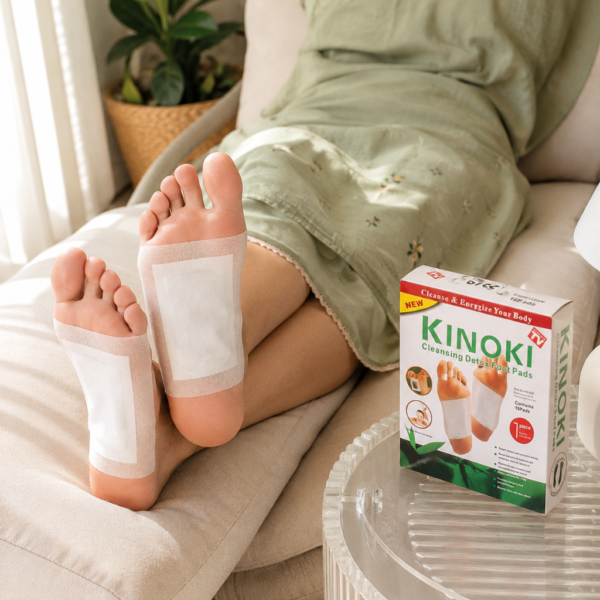 Applying Kinoki Detox Foot Pads on Sole of Foot
